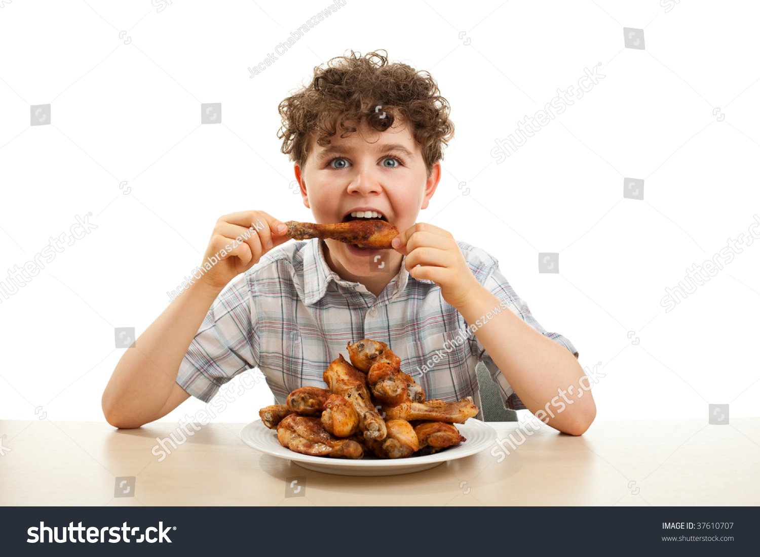stock-photo-kid-eating-chicken-drumsticks-isolated-on-white-37610707.jpg
