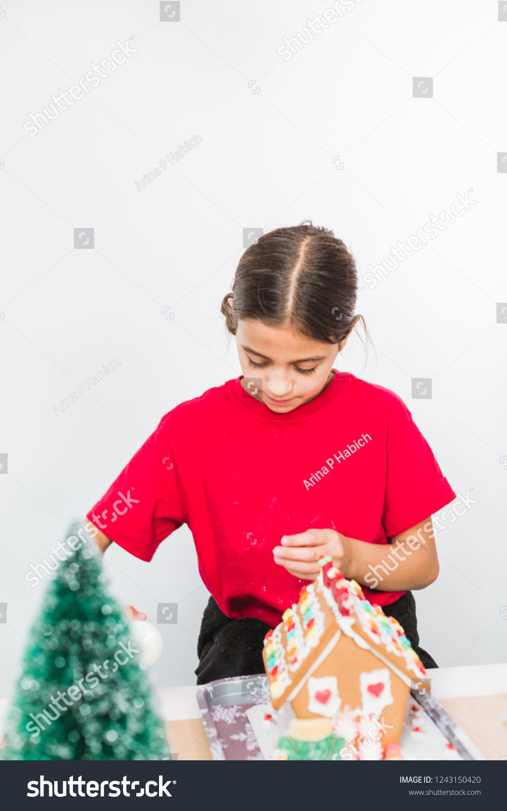 Download Kids Decorating Small Gingerbread Houses Christmas Stock Photo Edit Now 1243150420 3D SVG Files Ideas | SVG, Paper Crafts, SVG File