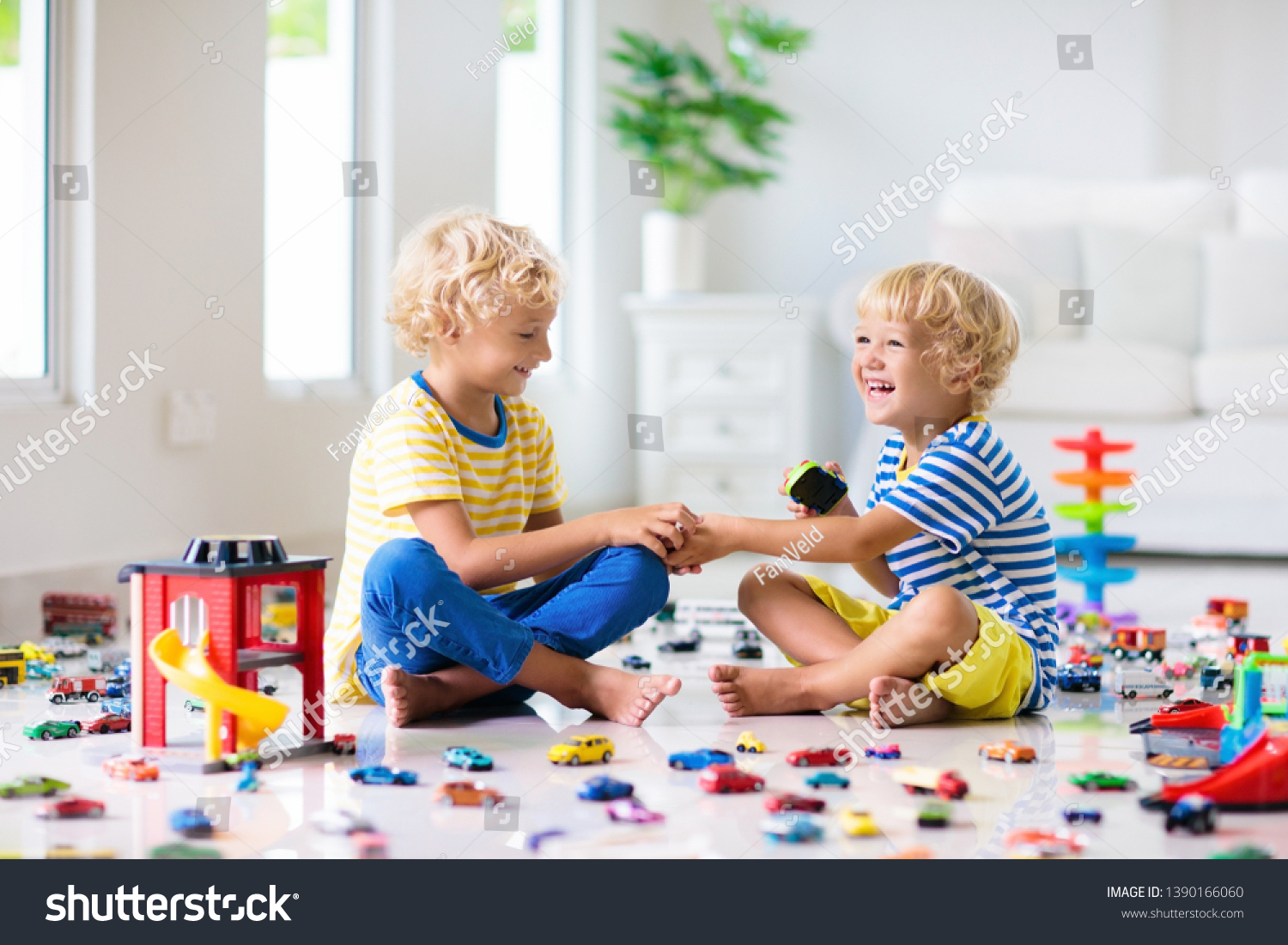 kids playing with toy trucks