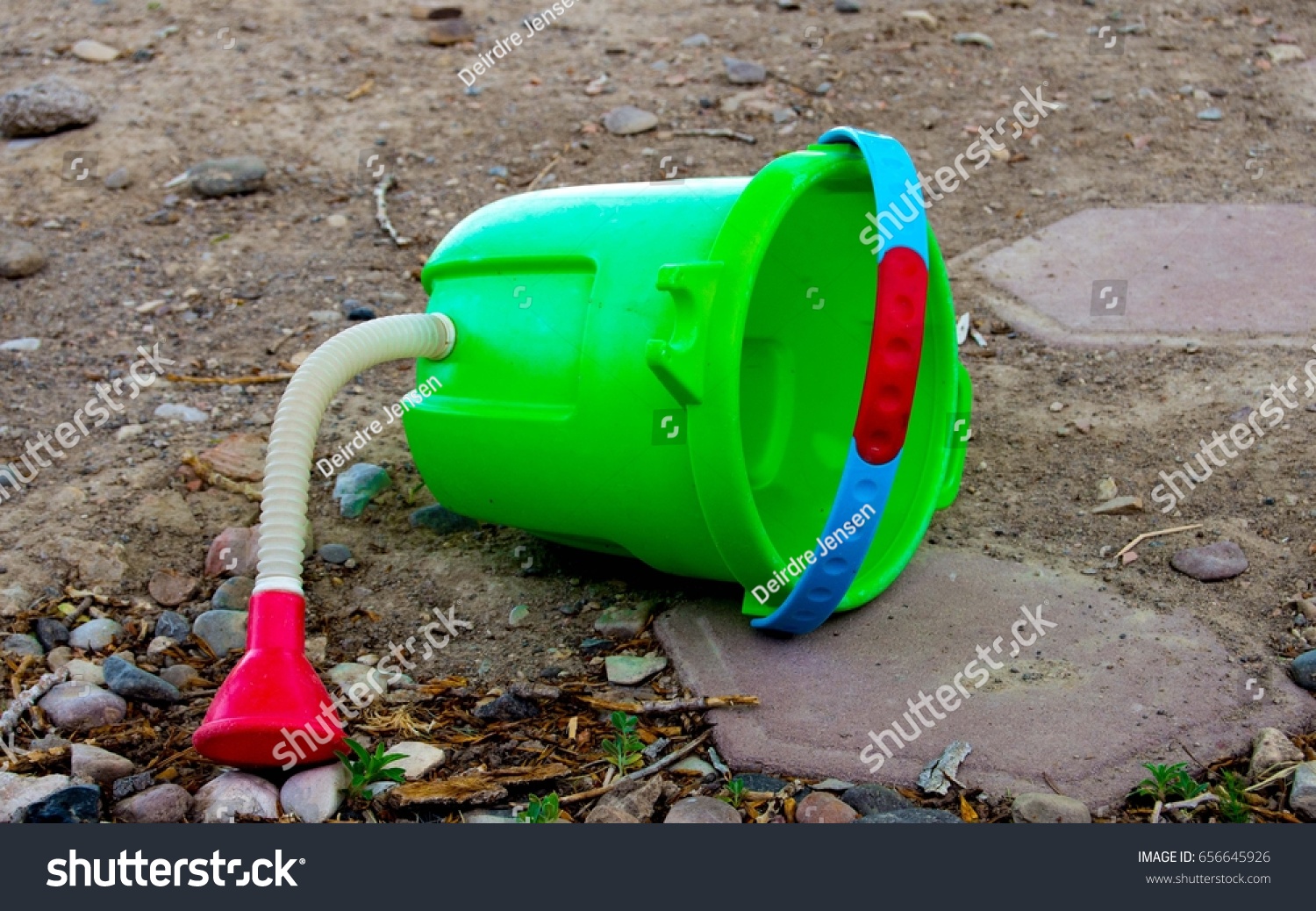 sand bucket with water hose