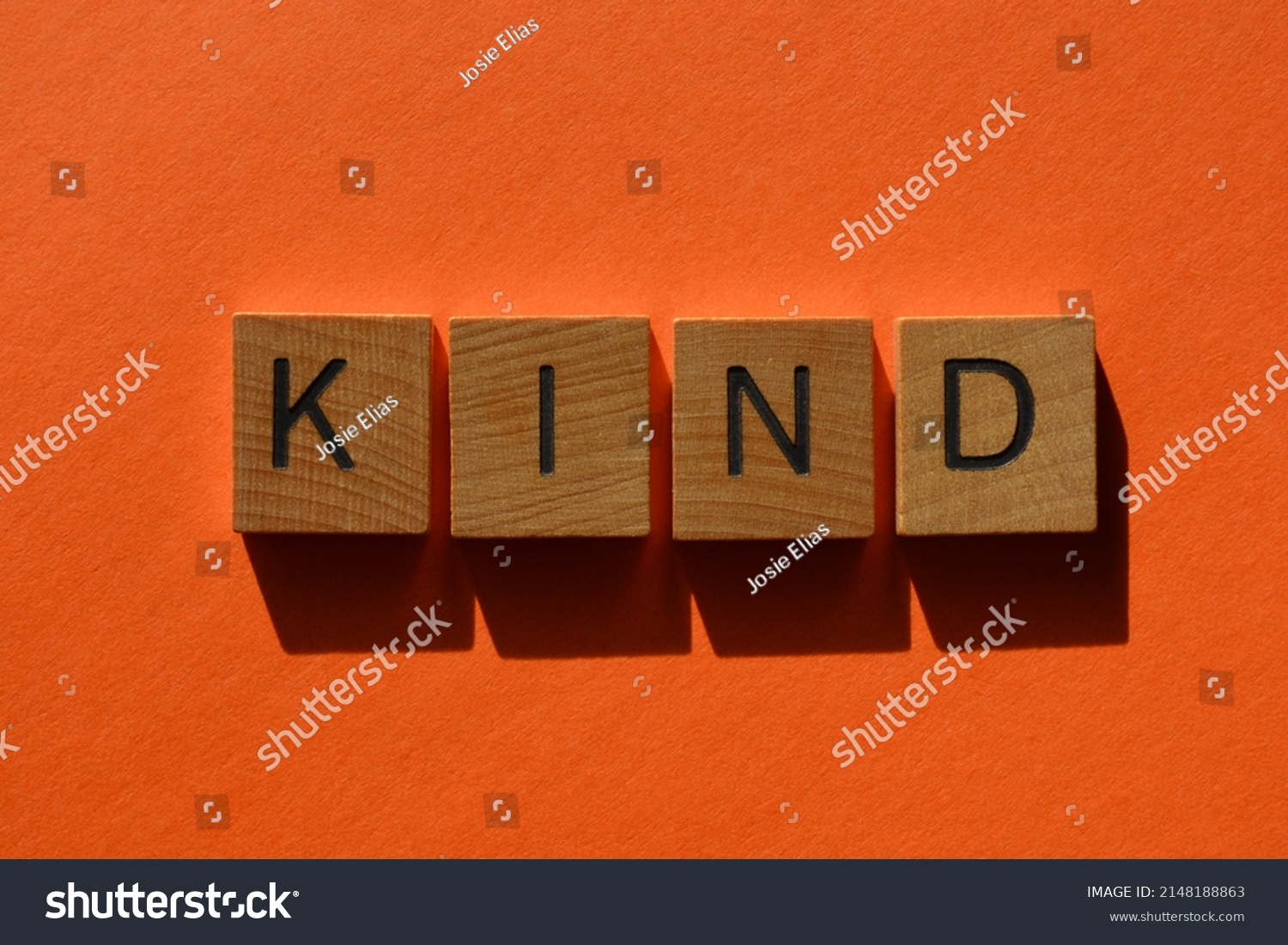 kind-word-wooden-alphabet-letters-isolated-stock-photo-2148188863