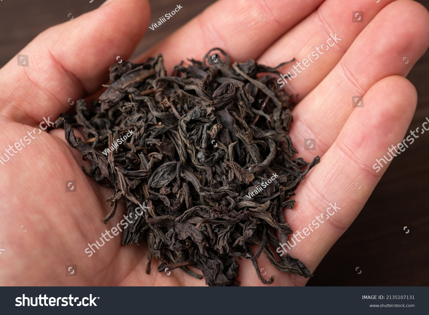 largeleaved-black-tea-hand-person-black-stock-photo-2135107131