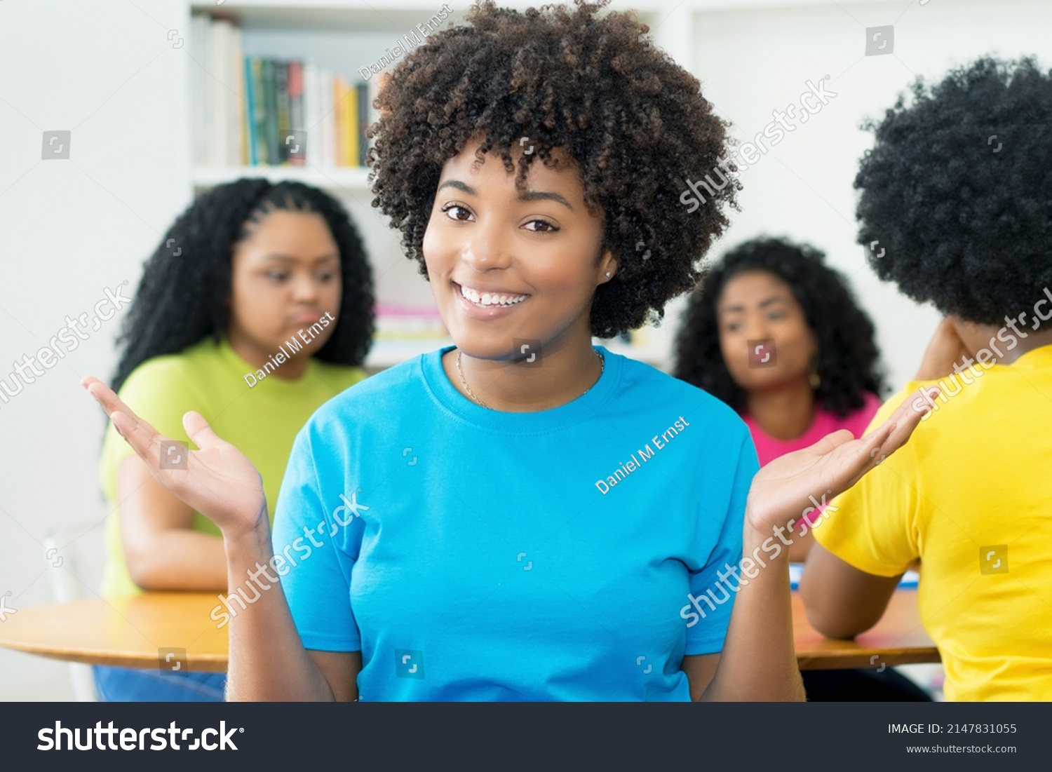 Laughing African American Female Student With Group Of Other Students