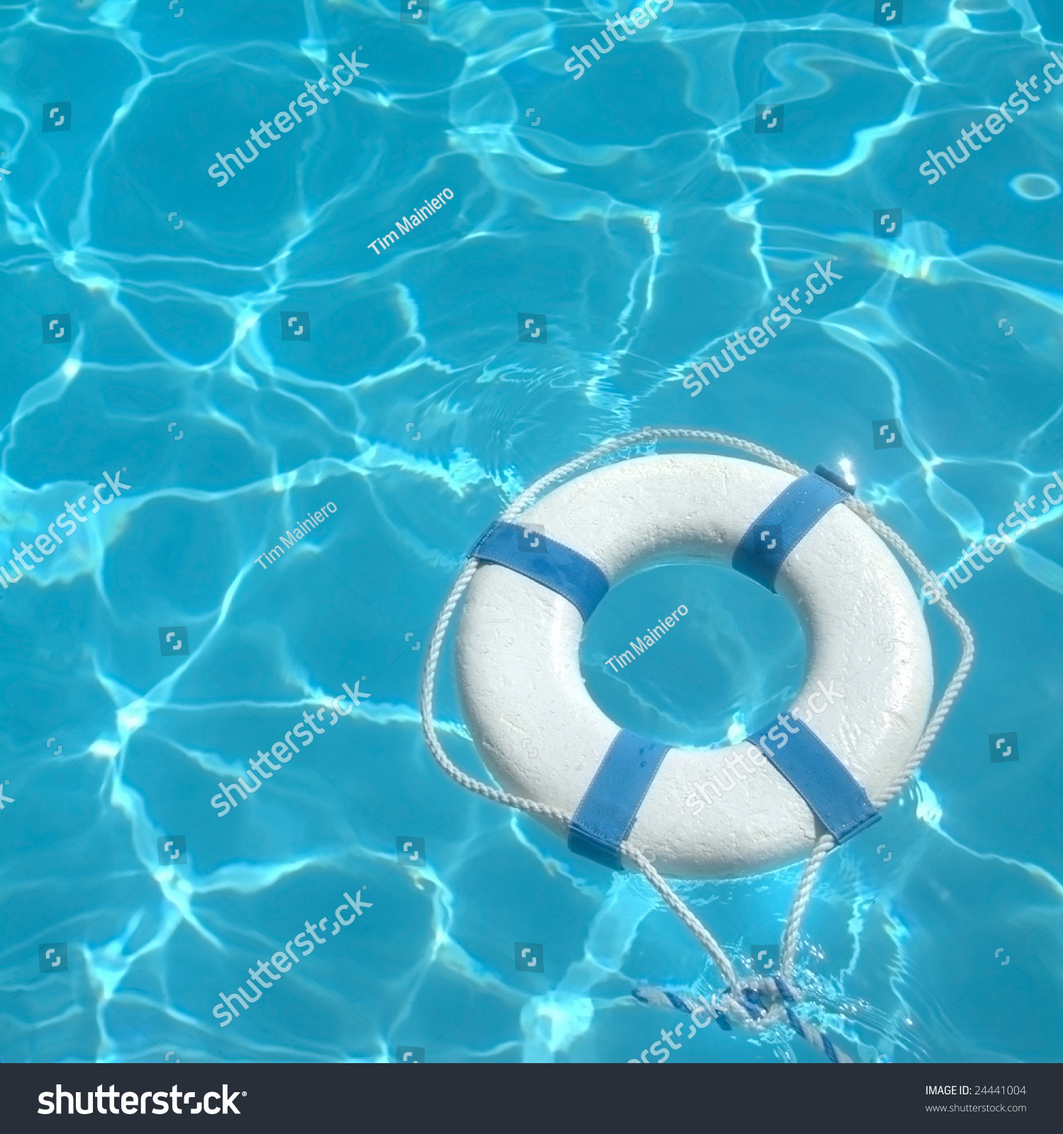 Life Ring Floating On Top Of Sunny Blue Water Stock Photo 24441004 ...