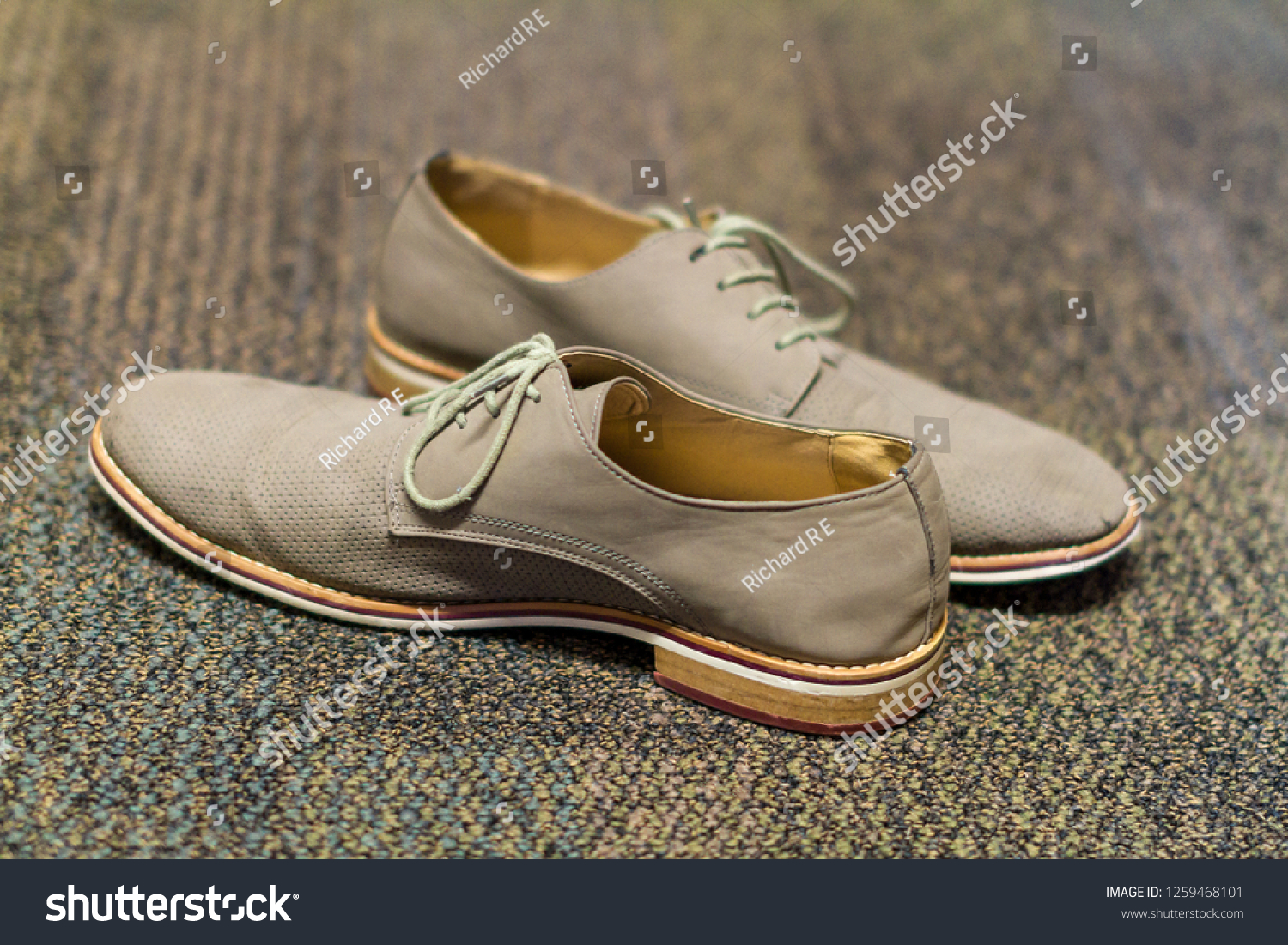 Light Colored Dress Shoes On Floor 