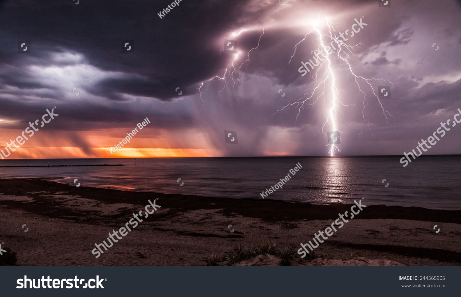 Lightening Storm Moving In Over Beach At Sunset. Stock Photo 244565905 ...