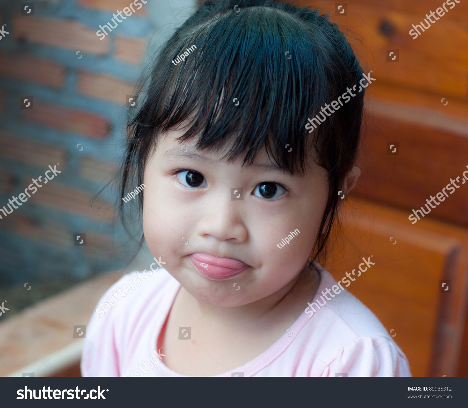 Little Asian Girl Sticking Tongue Out Stock Photo 89935312 | Shutterstock