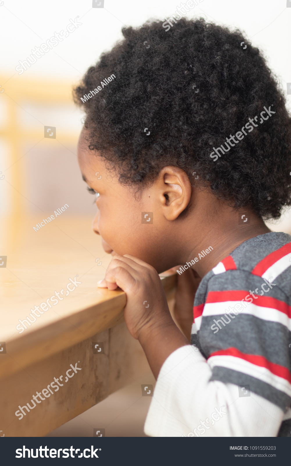 Little Black Boy Leaning On Table Stock Photo Edit Now 1091559203