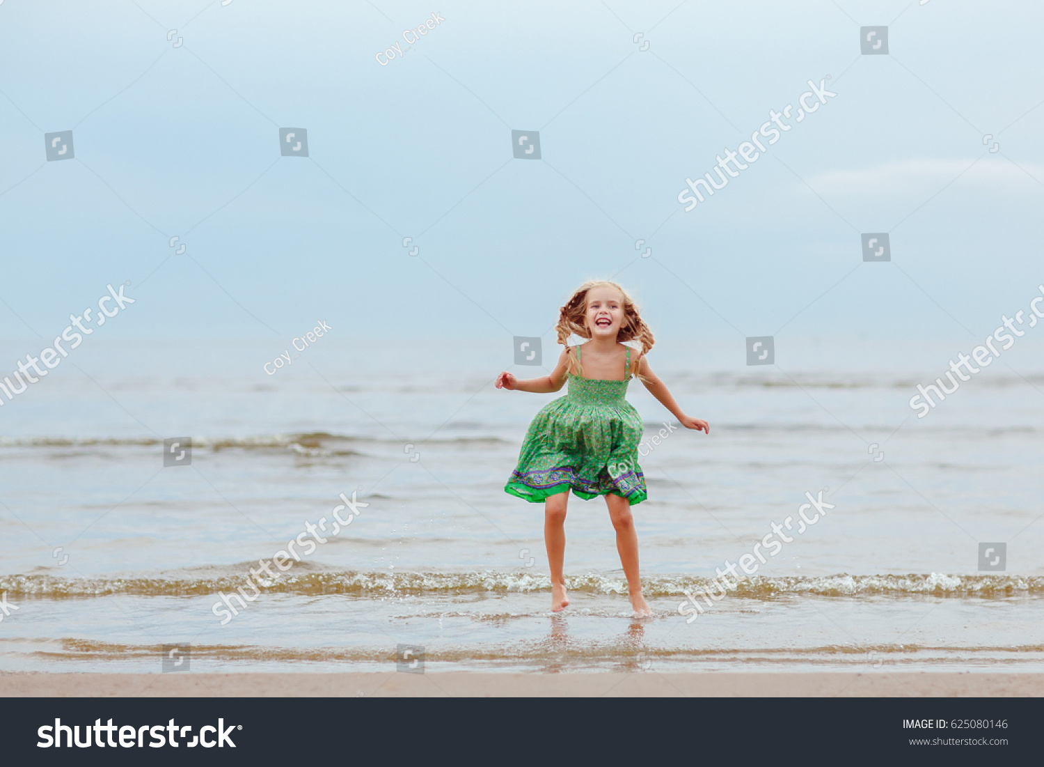 Little Blond Girl Squirting Laughing Seashore Stock Photo (Edit Now ...