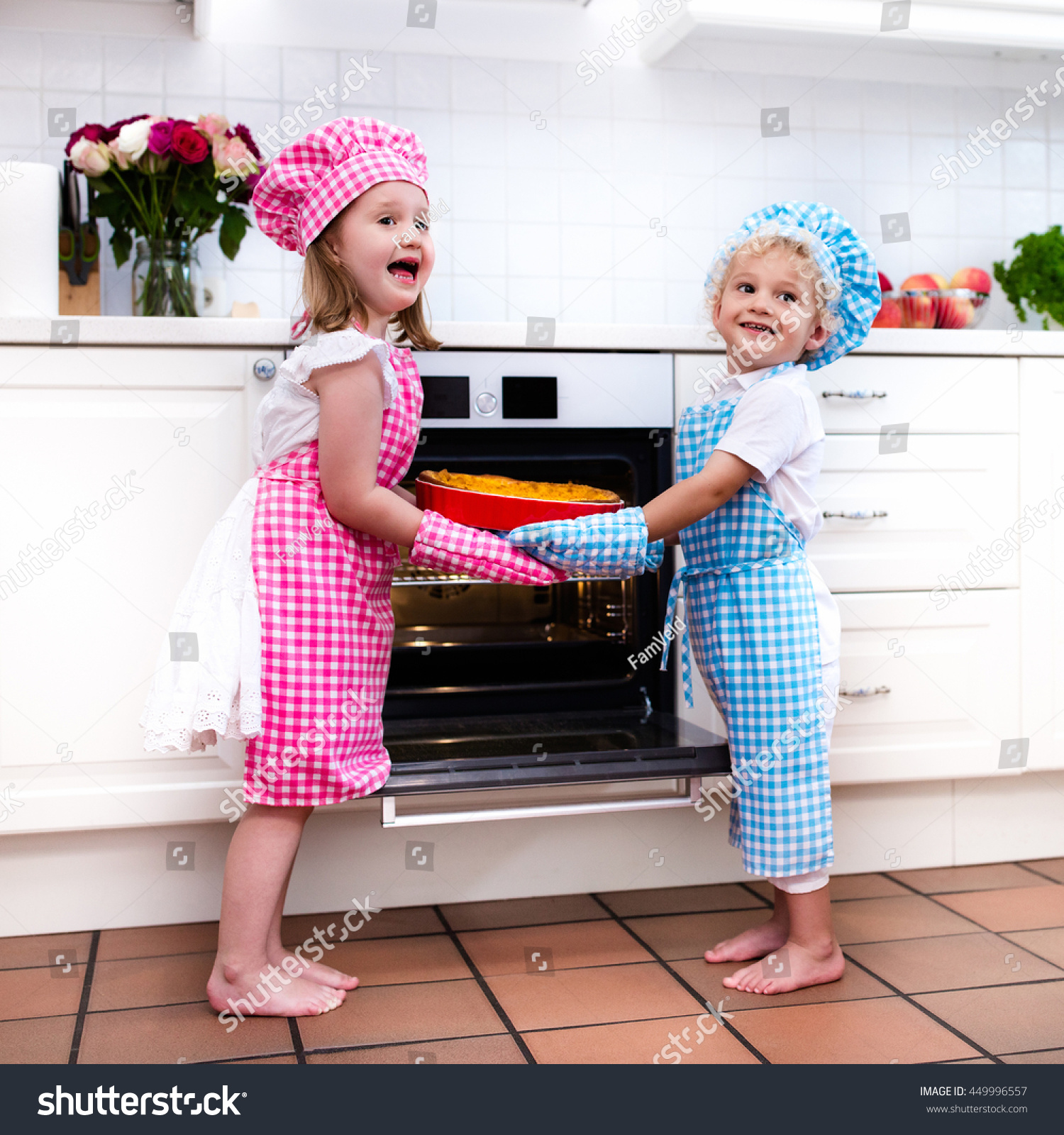 Image result for pic of a little boy and a little girl making cake