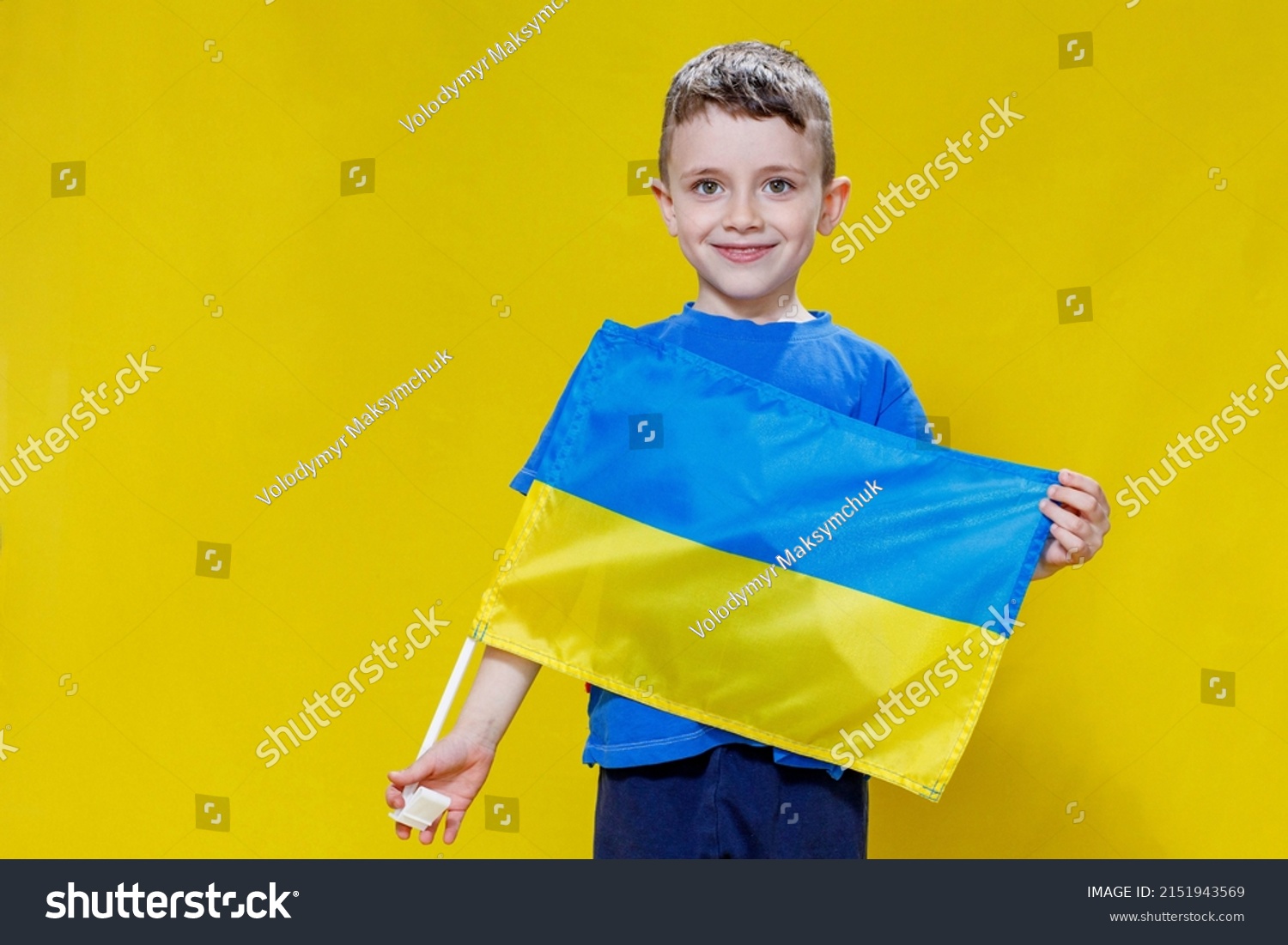 Little Boy Smiling Holding Yellow Blue Stock Photo 2151943569 ...