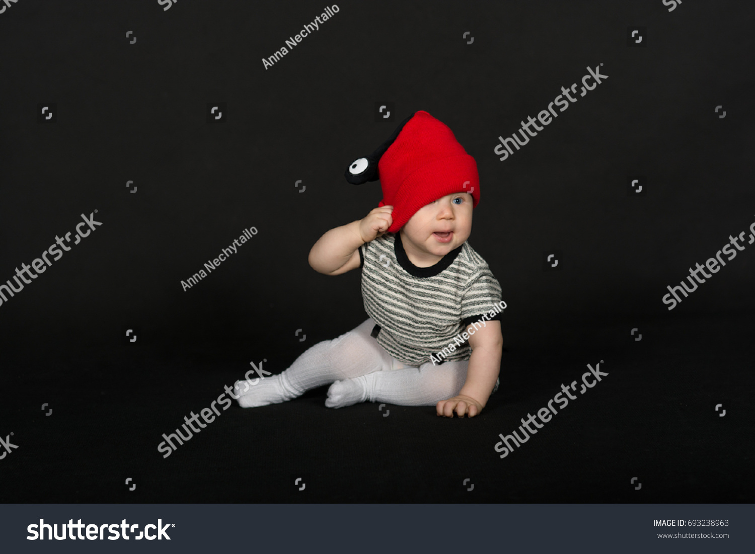 black baby red hat