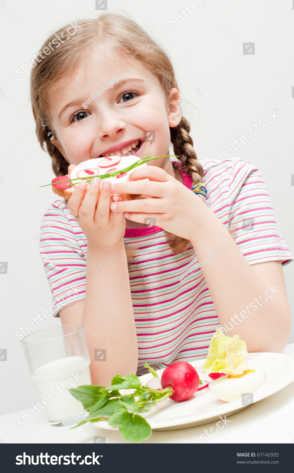 Little Girl Eating Healthy Breakfast Stock Photo 67142935 : Shutterstock