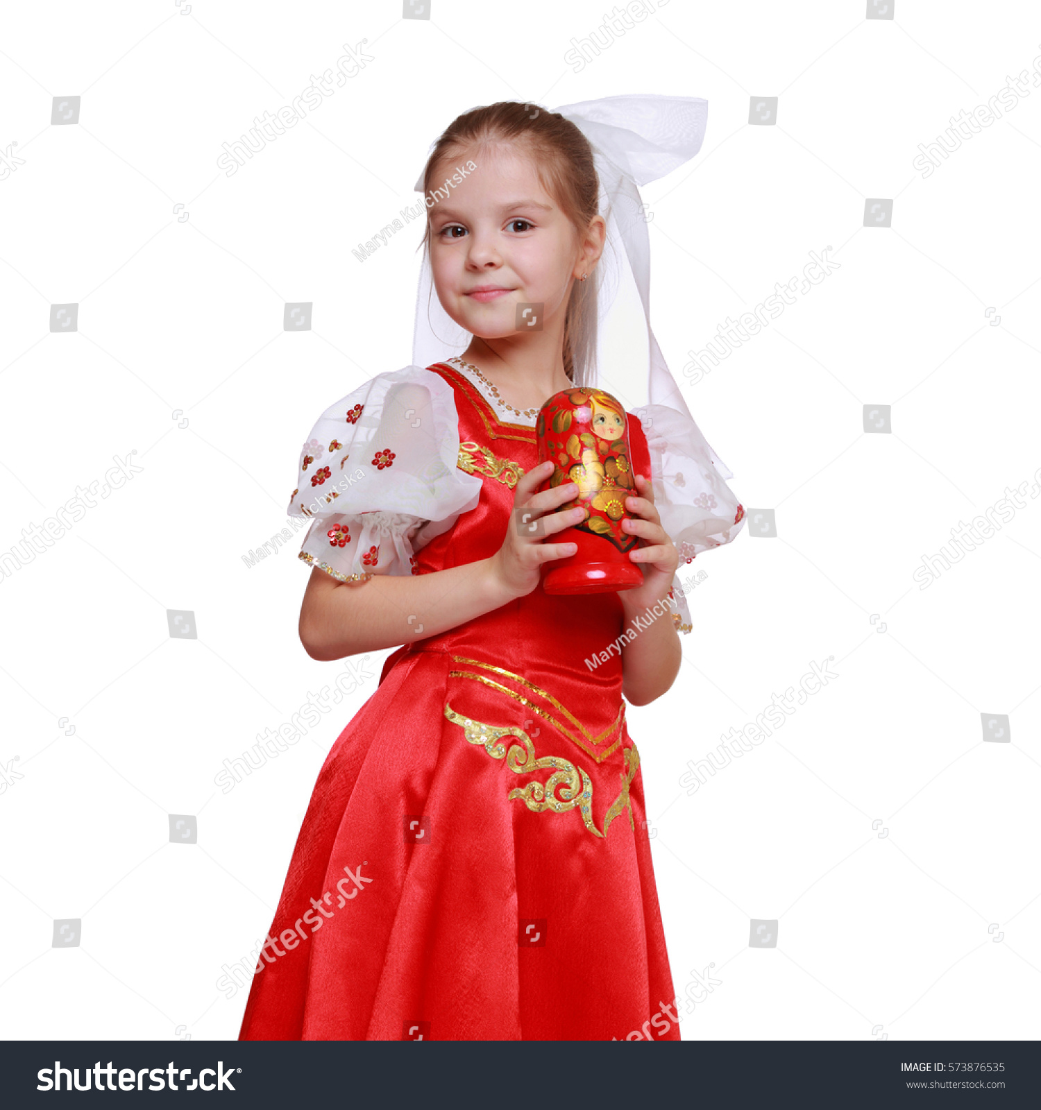 little girl holding doll