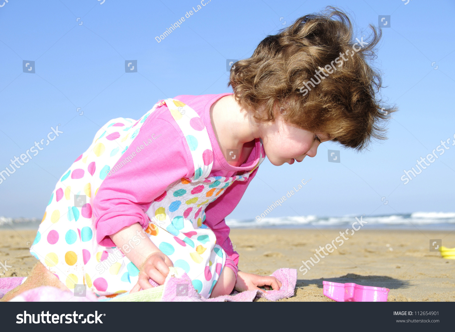 Little Girl Playing On Beach Stock Photo 112654901 