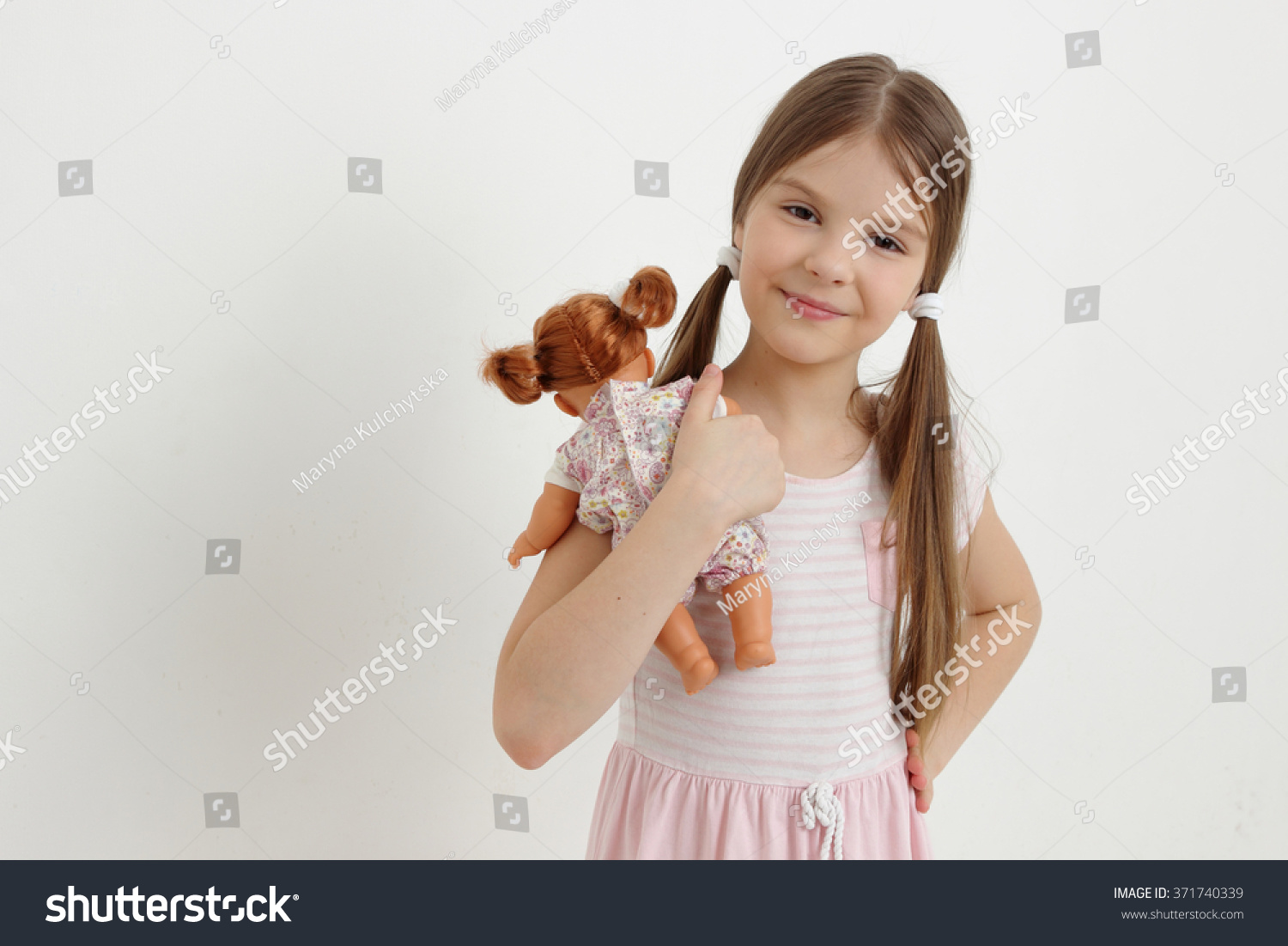 Little Girl Playing With Baby Doll Stock Photography ...