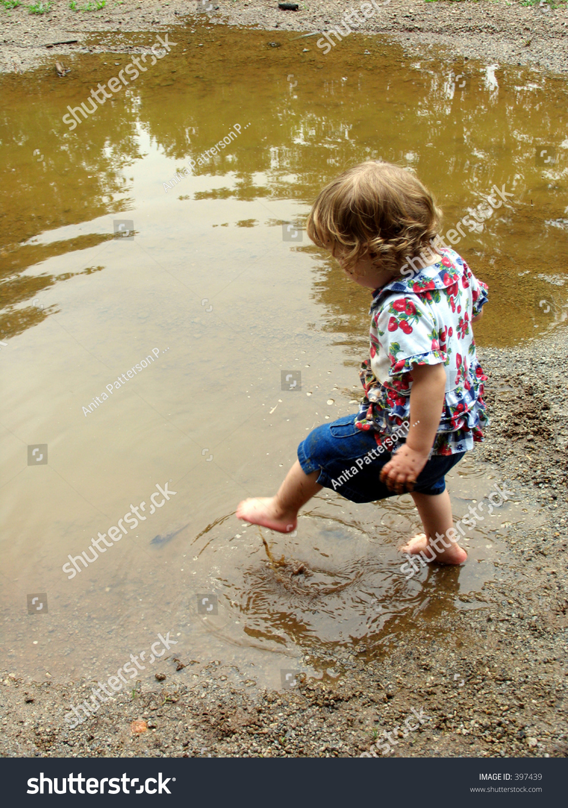 Little Girl Stepping Into Mud Puddle Stock Photo 397439 - Shutterstock