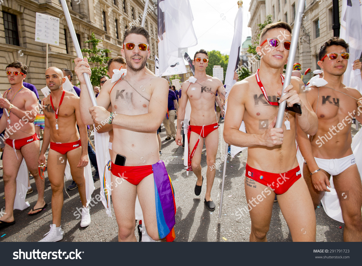 stock-photo-london-uk-th-june-group-of-semi-naked-young-gay-men-that-took-part-in-the-pride-in-291791723.jpg