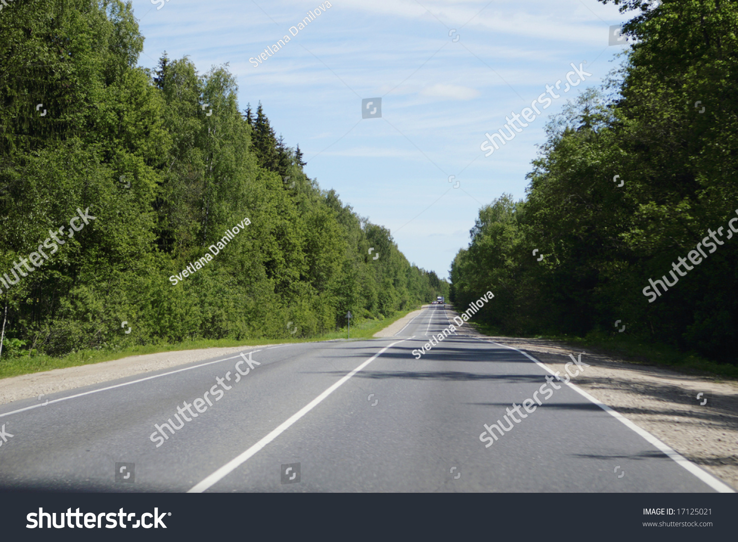 Long Road Stretching Out Into The Distance Under A Dramatic Blue Sky ...