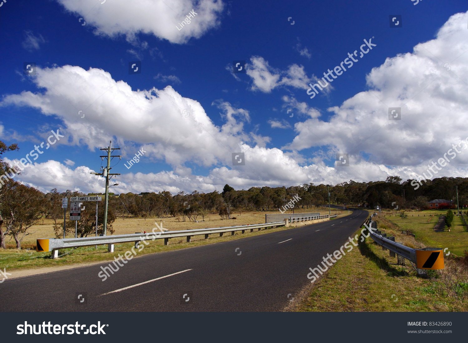 Long Straight Road In Remote Area Of Australia Under Sunny Blue Sky ...