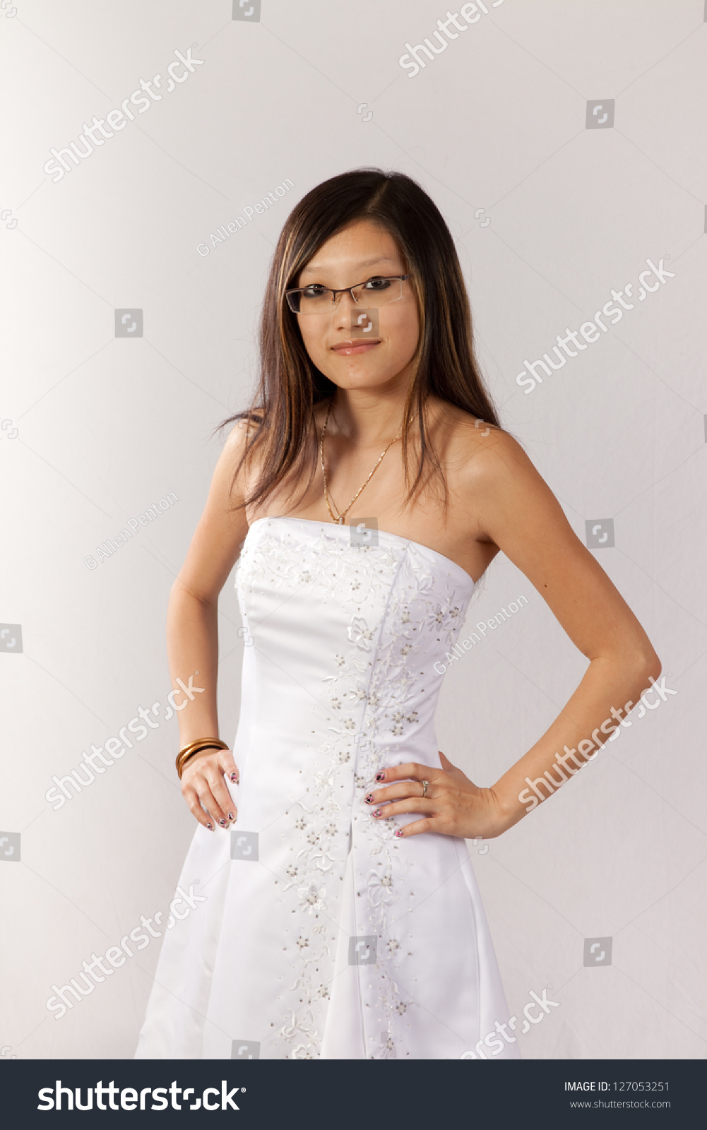 https://image.shutterstock.com/z/stock-photo-lovely-east-asian-bride-in-her-white-wedding-dress-looking-at-the-camera-with-a-happy-friendly-127053251.jpg