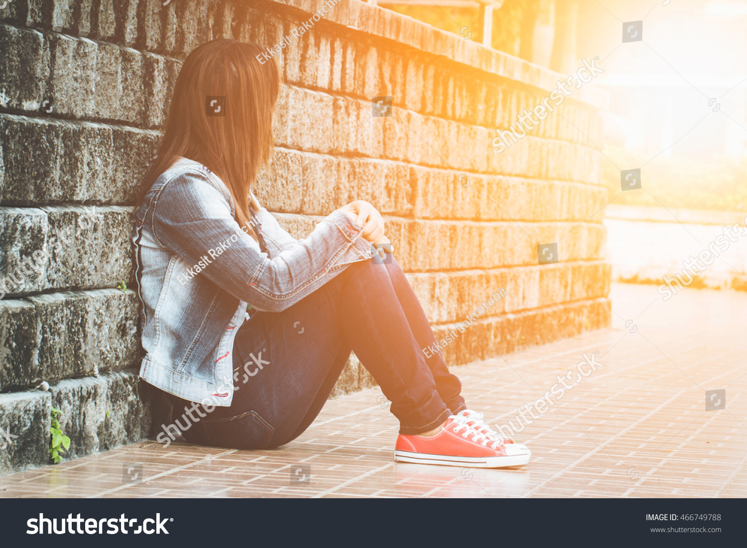 Young Woman Sitting Alone By The Window. Look Like Her Sad 