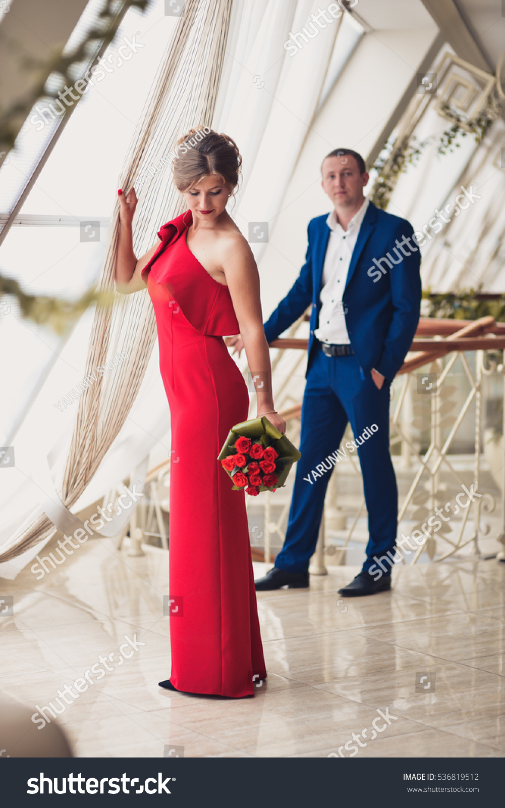 blue suit red dress