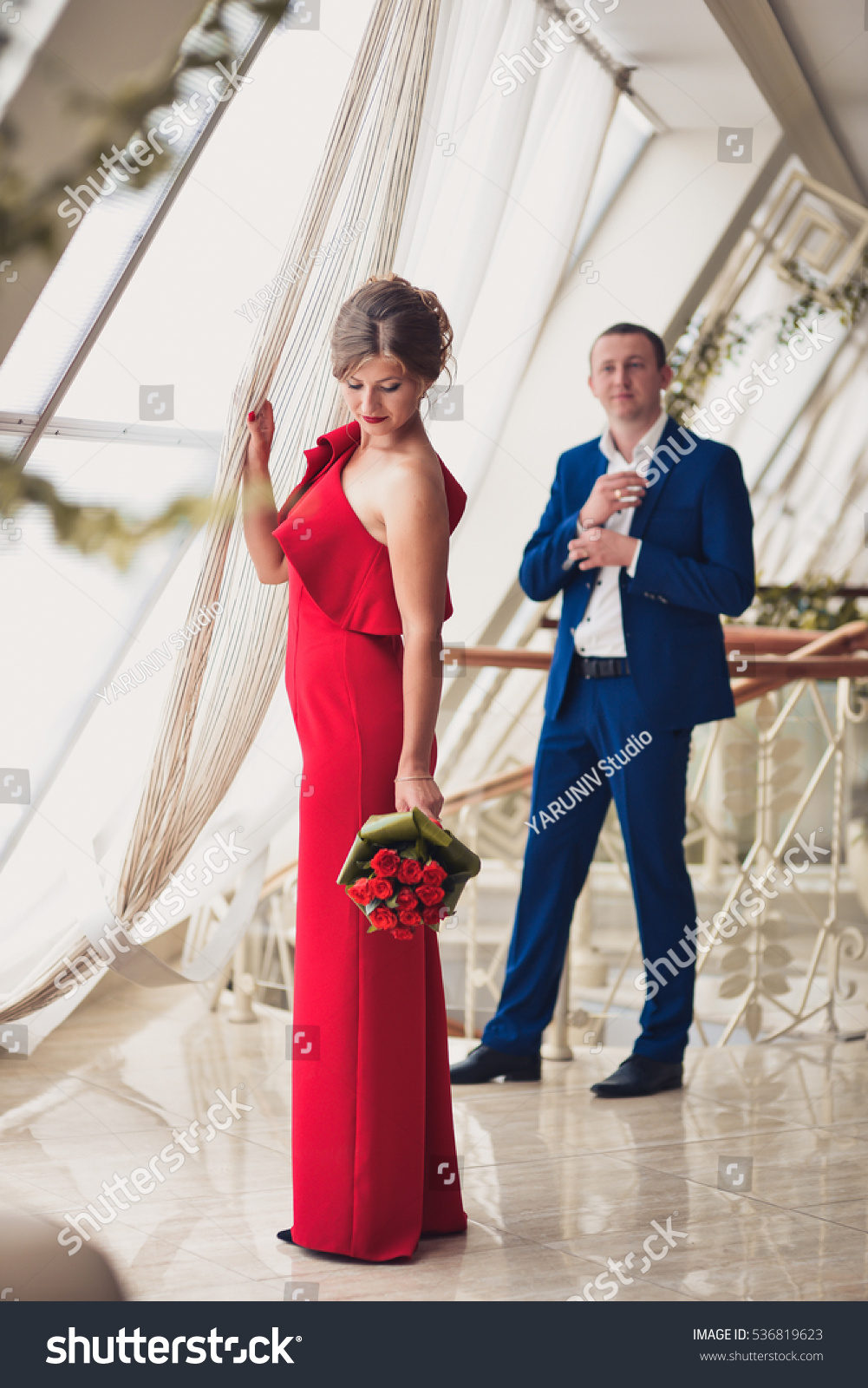 red dress with blue suit