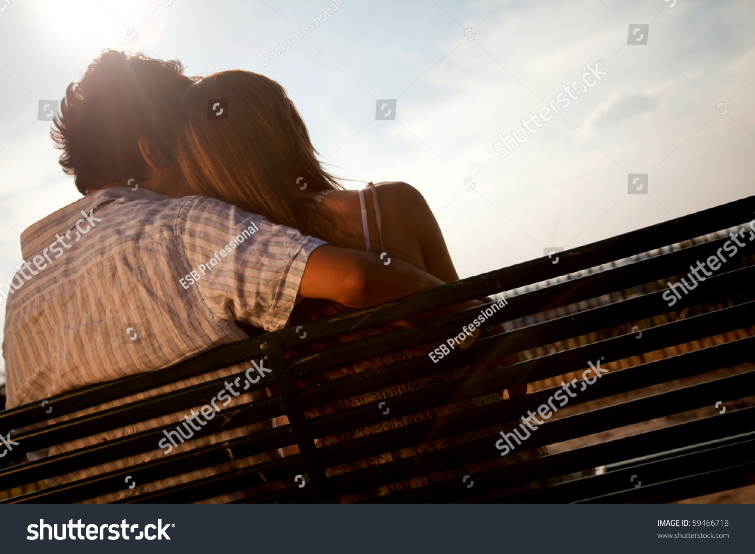 Loving Couple Sitting On A Bench Enjoying The Sun Stock Photo 59466718 ...