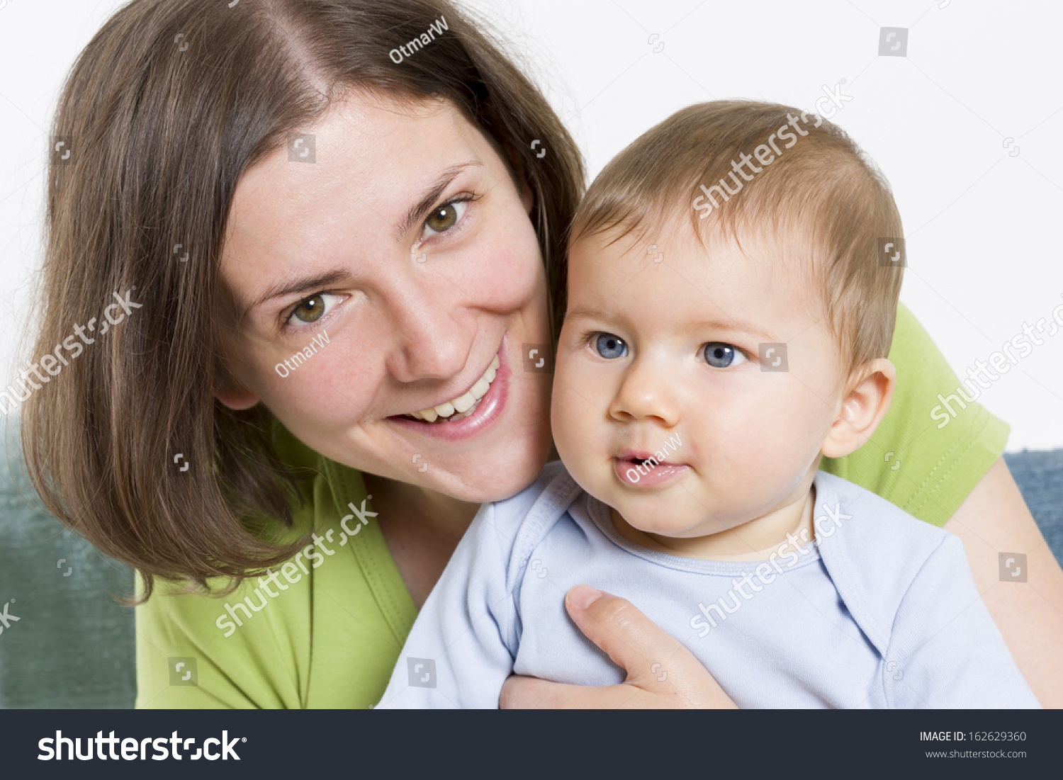 Loving Moments Joyous Smiling Mother Holding Her Cute Baby Boy In