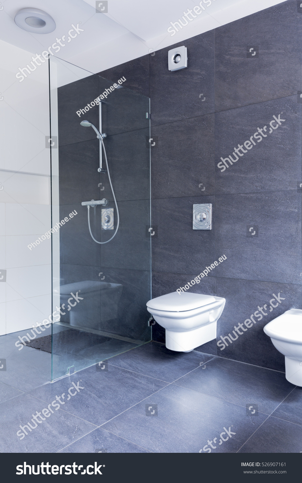 Stock Photo Luxurious Grey Bathroom With Large Granite Tiles On The Floor And Walls And Glass Shower Screen 526907161 