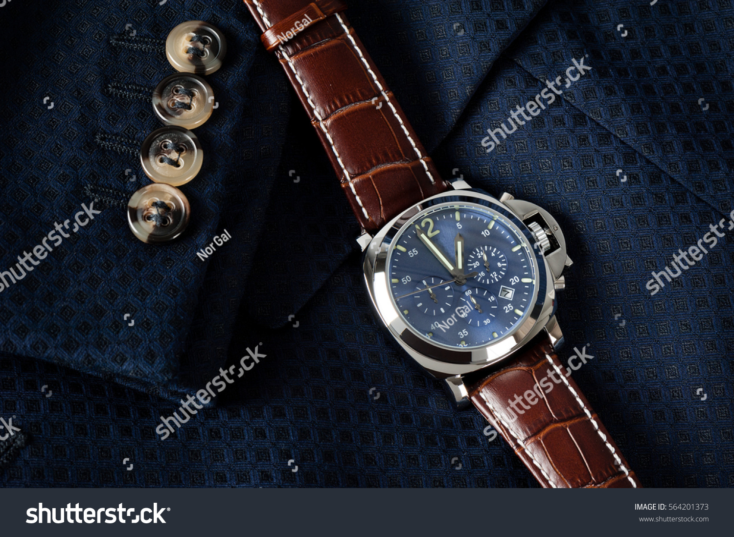 blue dial watch with brown strap