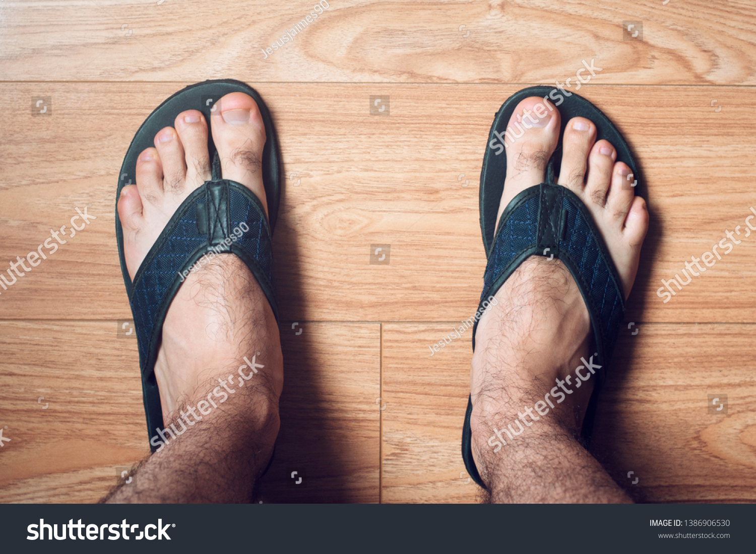 men's feet in flip flops