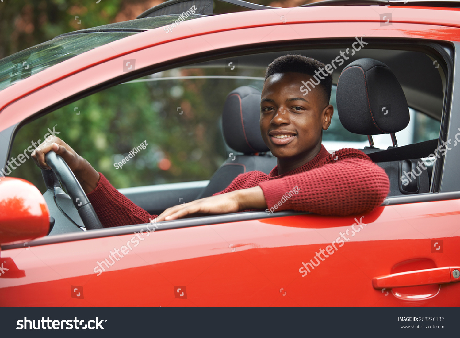 Male Teenage Driver Looking Out Of Car Window Stock Photo 268226132 ...