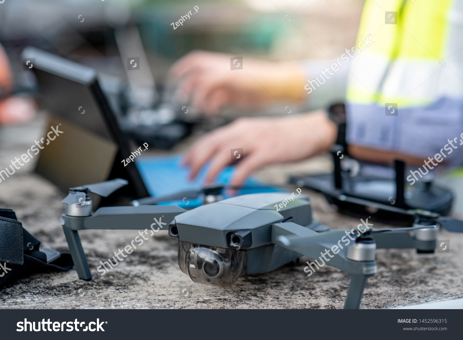 male worker using drone remote control stock photo edit now 1452596315 shutterstock