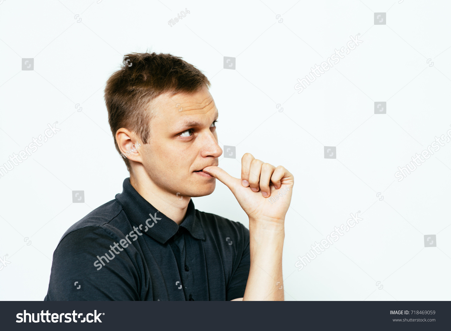 man-bites-his-nails-stock-photo-edit-now-718469059