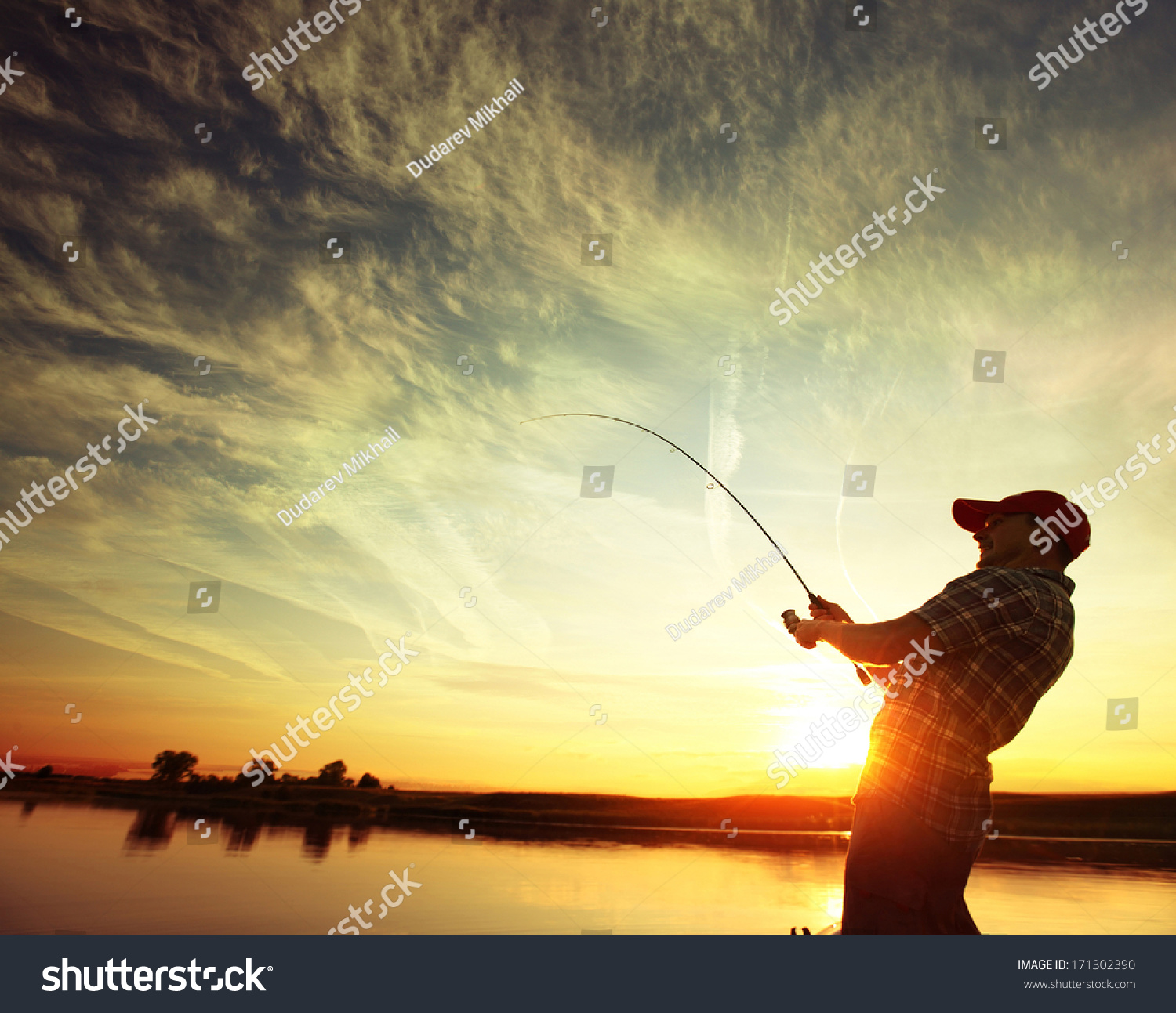 Man Fishing From A Boat At Sunset Stock Photo 171302390 : Shutterstock