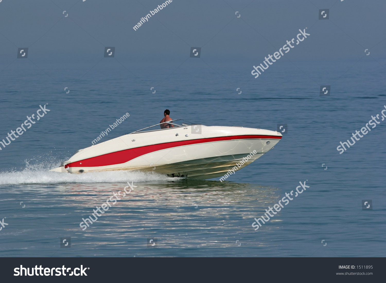 Man In A Powerful White And Red Speed Boat On The Sea. Stock Photo ...