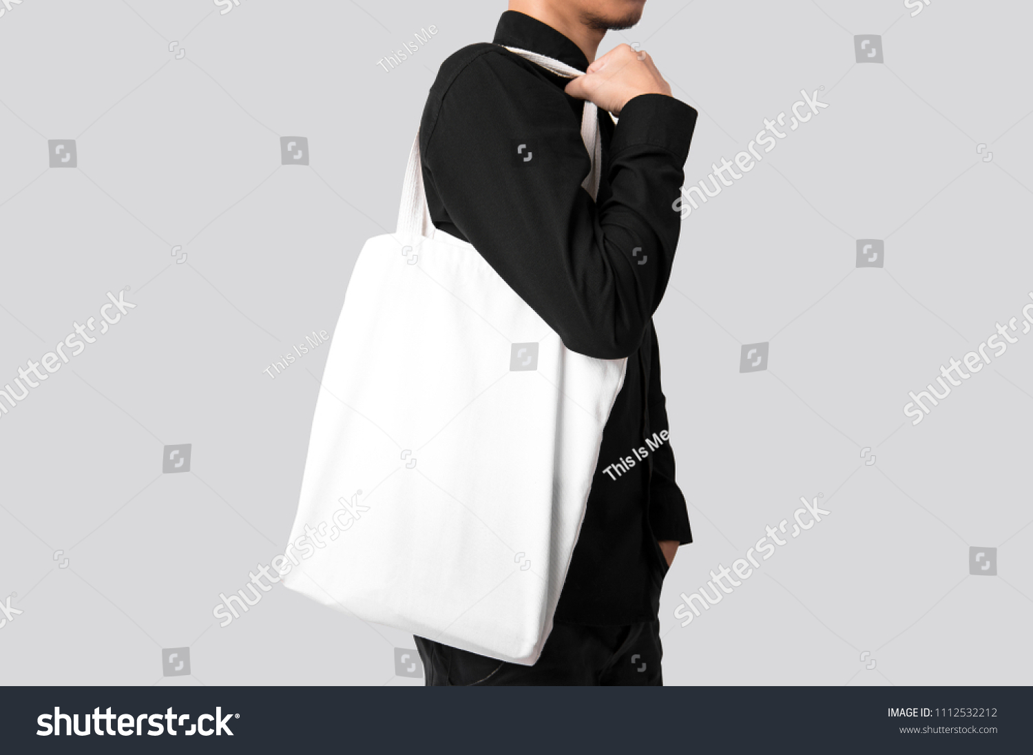 Download Man Holding Bag Canvas Fabric Mockup Stock Photo Edit Now 1112532212