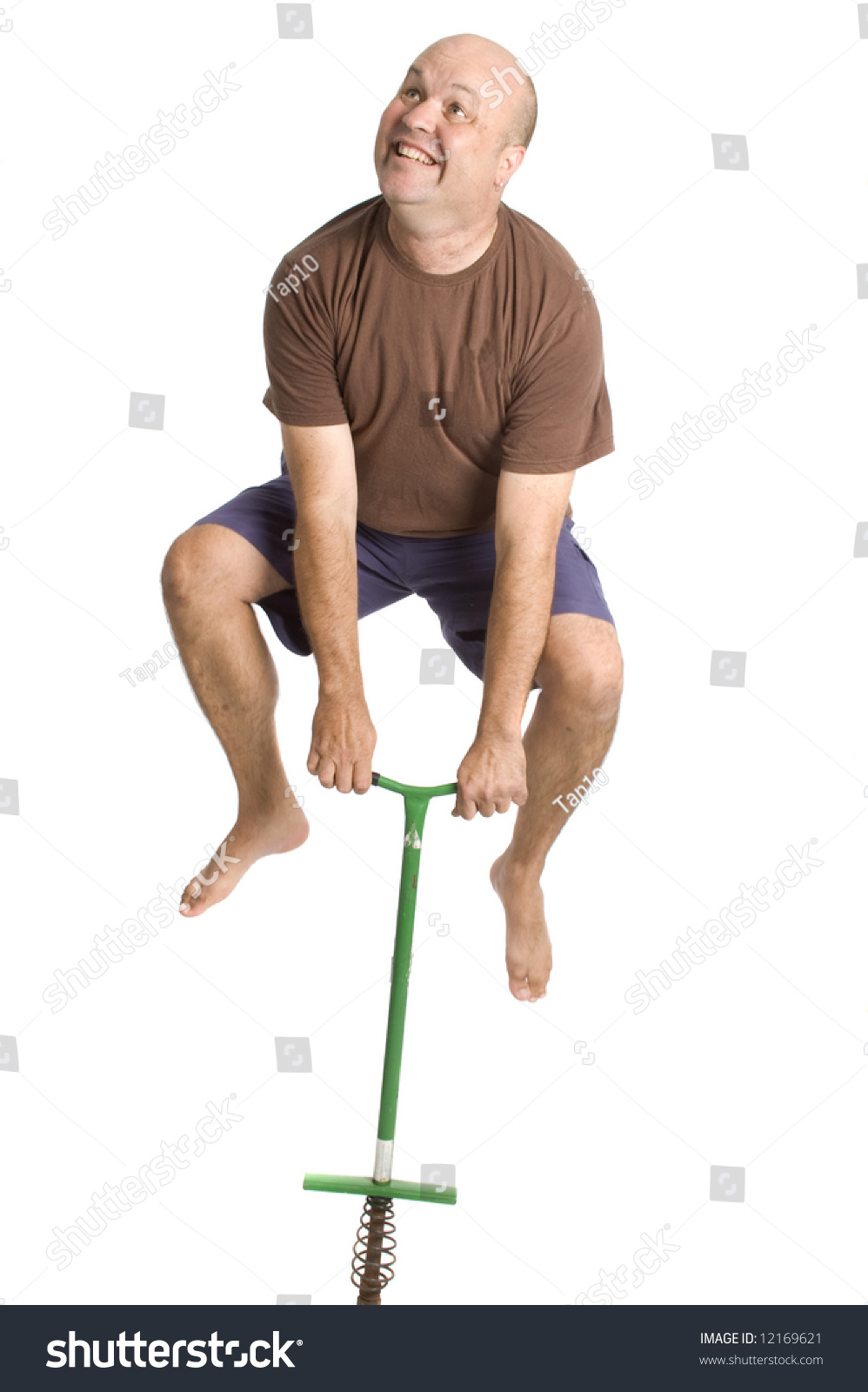 Man Jumping Pogo Stick Stock Photo 12169621 | Shutterstock