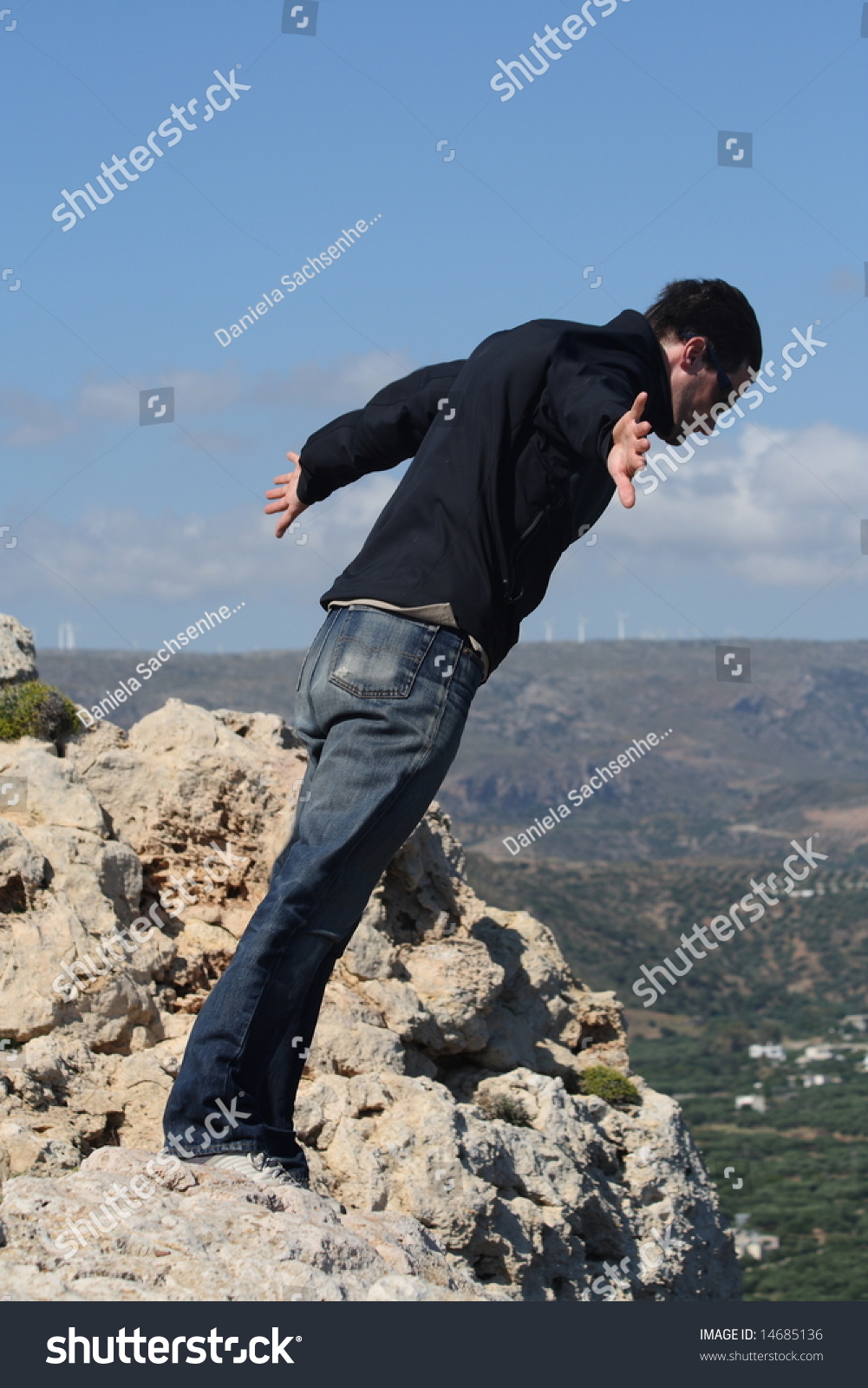 Man Leaning Against Strong Wind Stock Photo 14685136 - Shutterstock