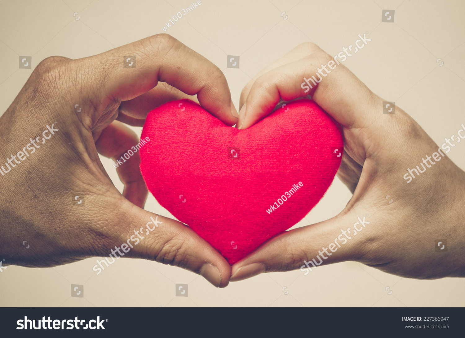 Man'S Hand And Woman'S Hand Holding A Red Heart Stock Photo 227366947 ...