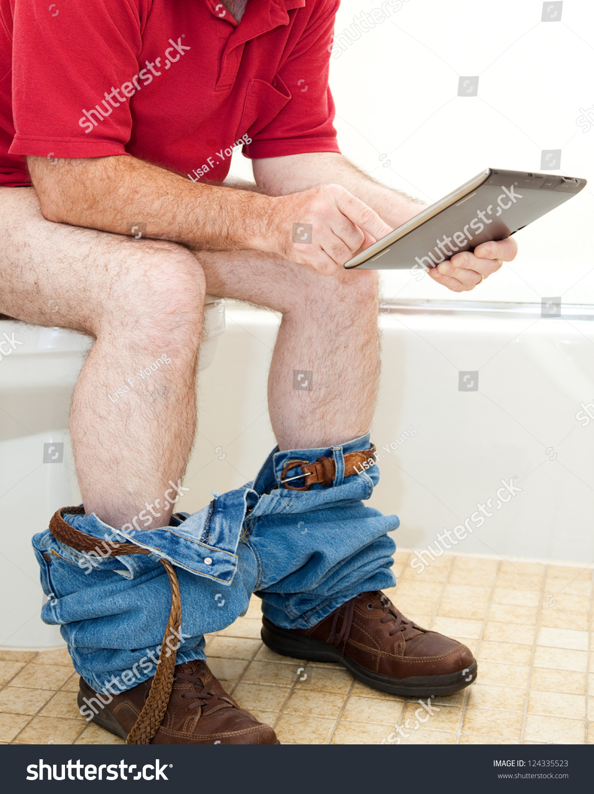 Young Man Sitting On Toilet Bowl Stock Photo - Image of 