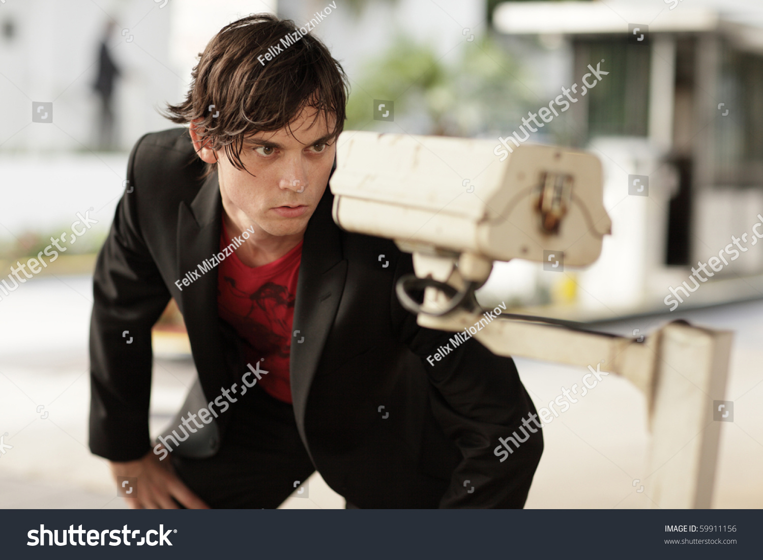 man staring surveillance camera