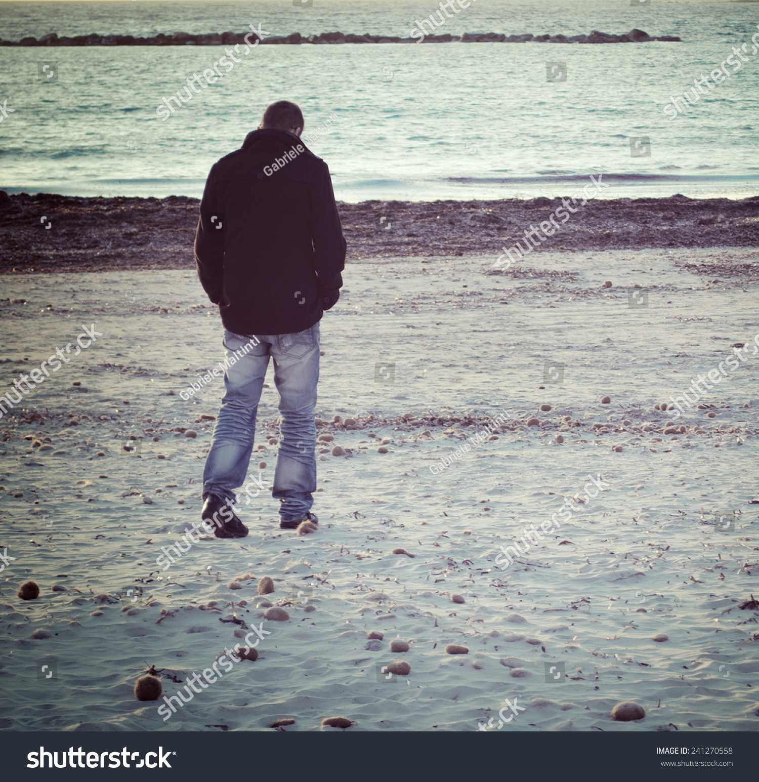 Man Walking Alone By Sea Winter Stock Photo 241270558 - Shutterstock