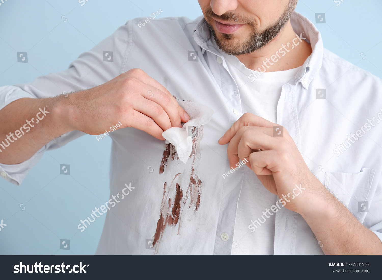 man-wiping-dirt-clothes-on-color-stock-photo-1797881968-shutterstock