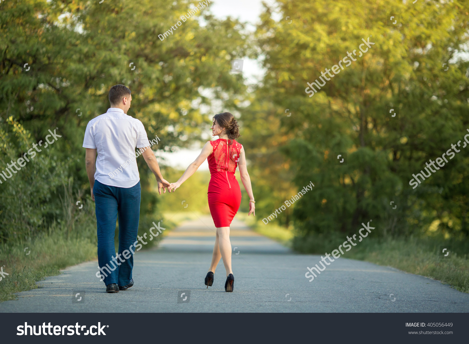 Man With Girl On Nature Holding Hands And Walking Away By The Road ...