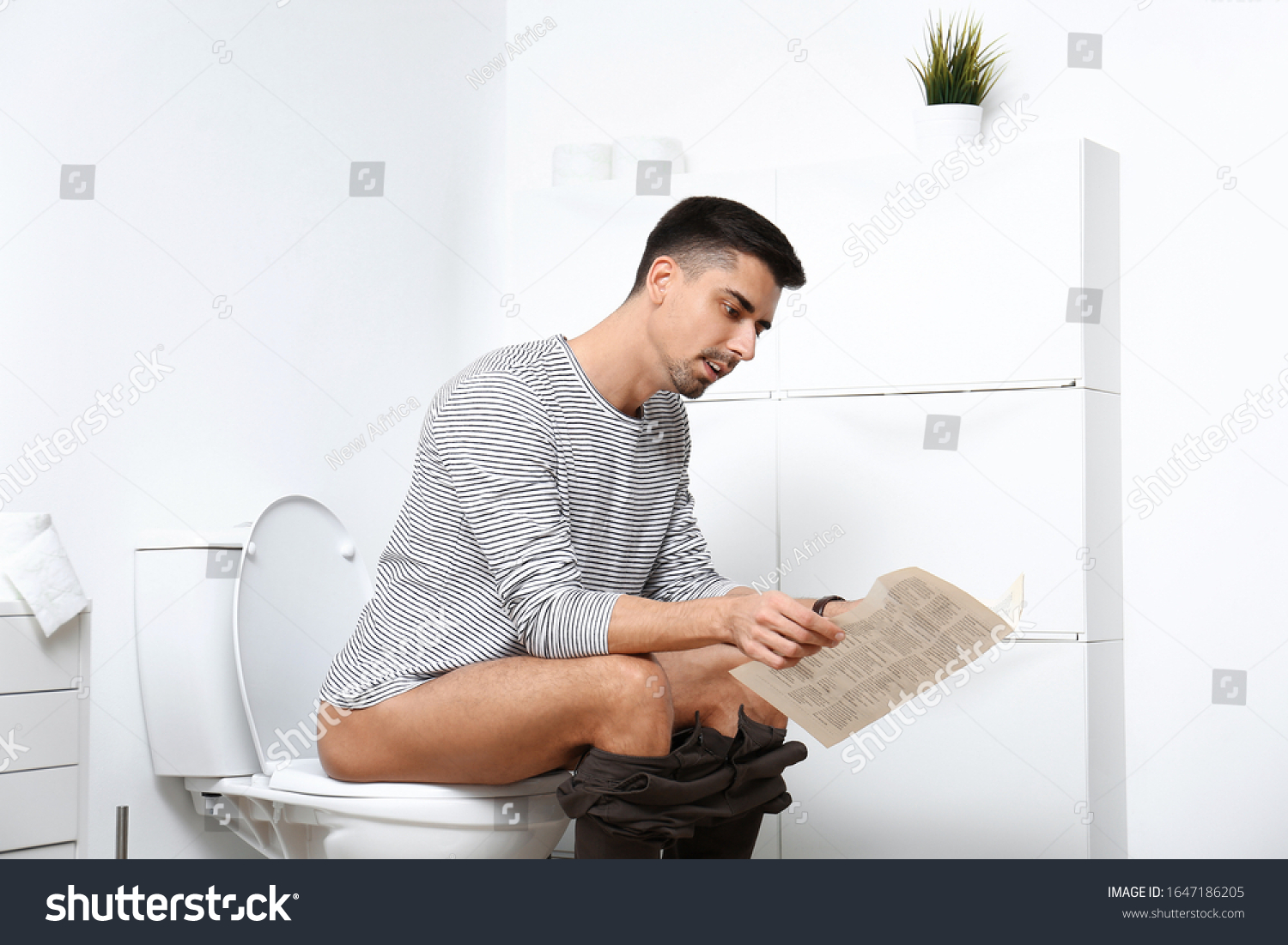 Man Newspaper Sitting On Toilet Bowl Stock Photo 1647186205 | Shutterstock