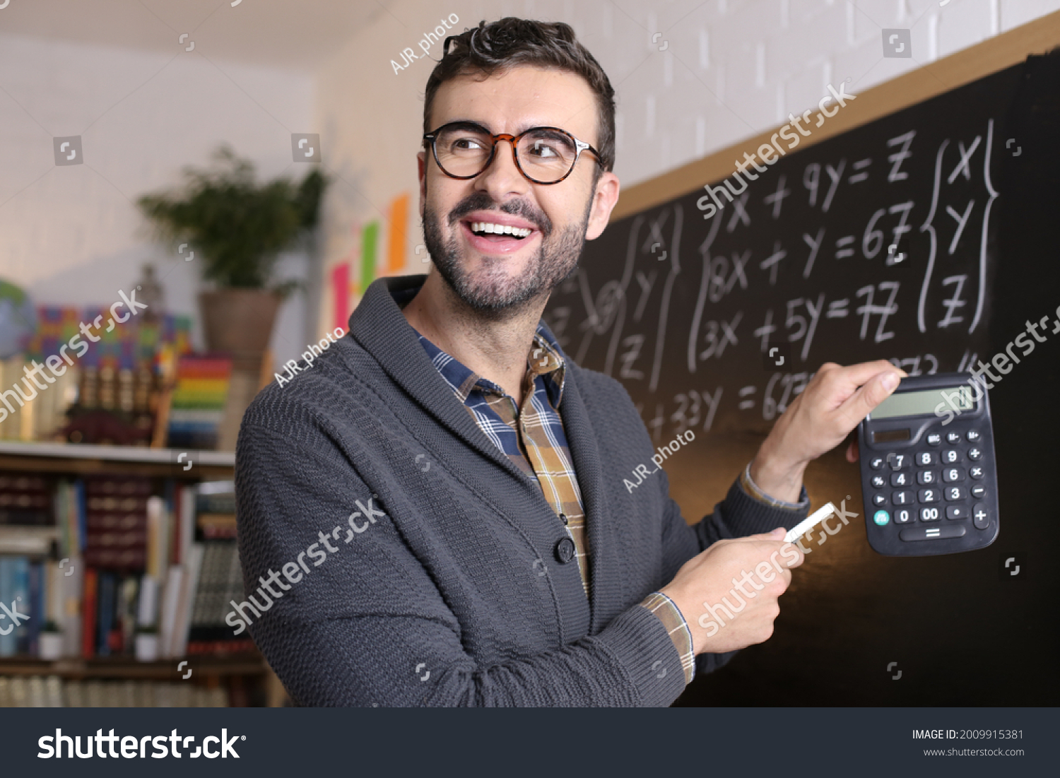 Math Teacher Holding Calculator Classroom Stock Photo 2009915381 ...