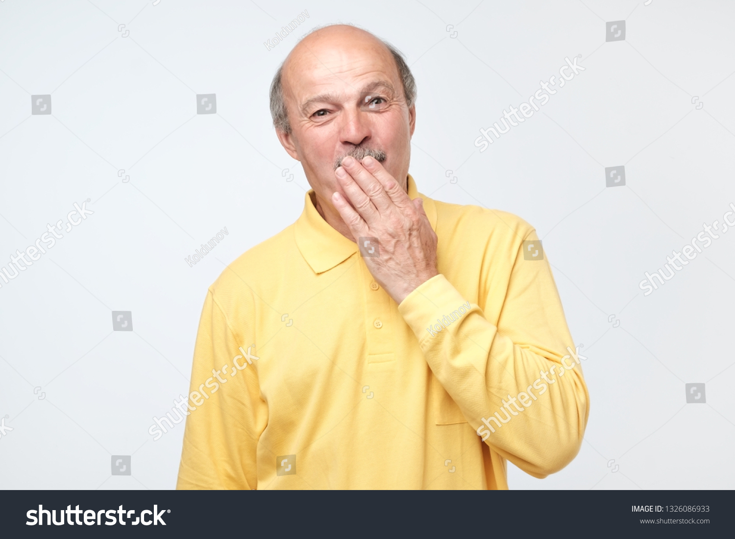 Mature Bald Man Covering Mouth Laughing Stock Photo (Edit Now) 1326086933